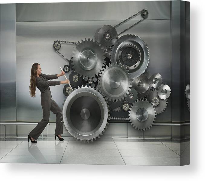 Working Canvas Print featuring the photograph Caucasian businesswoman working metal cogs by John M Lund Photography Inc