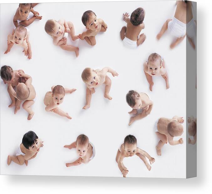 People Canvas Print featuring the photograph Portrait of a Large Group of Babies Looking Upwards by Digital Vision.