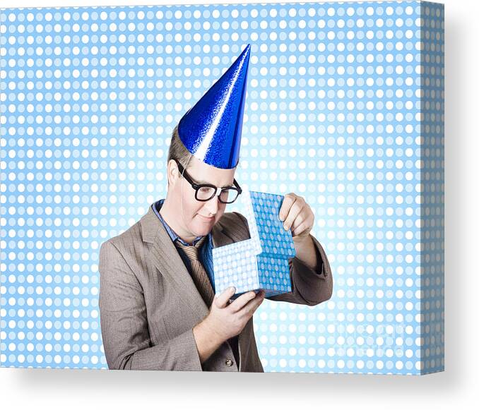 Bonus Canvas Print featuring the photograph Nerdy business man opening surprise present #1 by Jorgo Photography