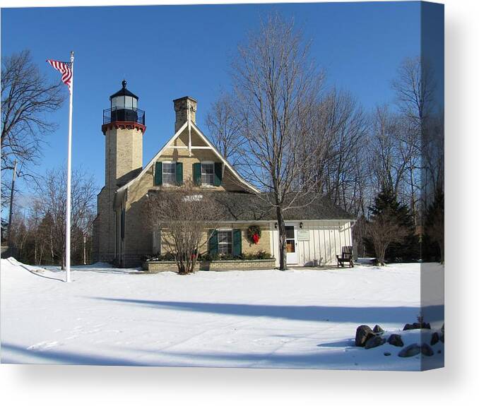 Winter Canvas Print featuring the photograph McGulpin Point Lighthouse in Winter by Keith Stokes