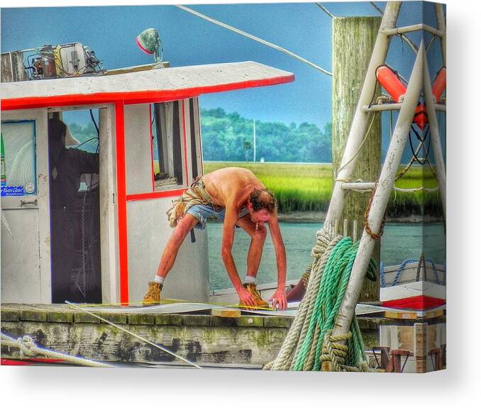 Fisherman Commercial Fishing Canvas Print featuring the photograph Fisherman Working on His Boat by Patricia Greer