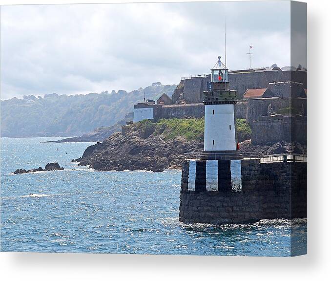 Coastal Scene Canvas Print featuring the photograph Guernsey Lighthouse by Gill Billington