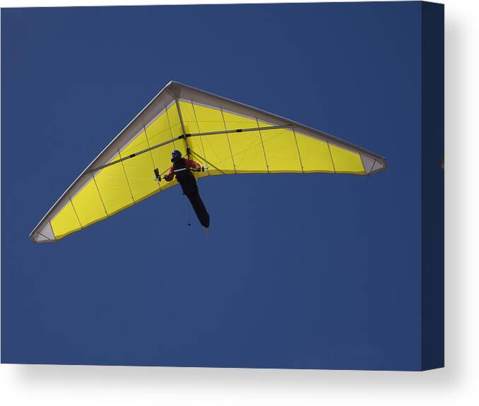 Hang-gliding Canvas Print featuring the photograph Low angle view of a person hang-gliding against clear blue sky by Tobias Titz