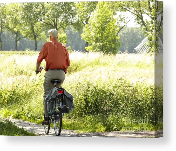 Old Canvas Print featuring the photograph Old man on a bike by Patricia Hofmeester