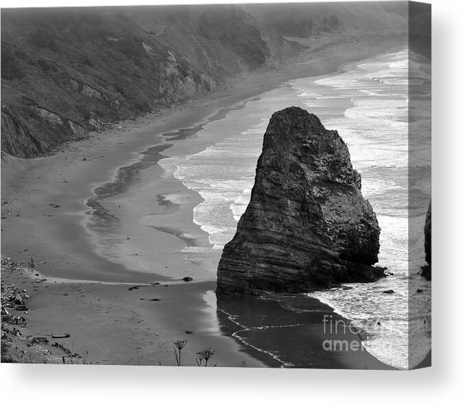 Beach Photographs Canvas Print featuring the photograph Towering Rock by Kirt Tisdale