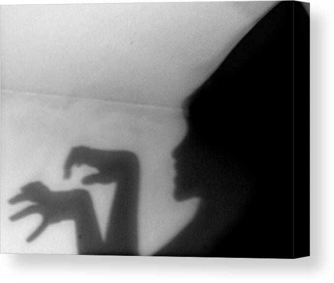 People Canvas Print featuring the photograph Wicked female shadow on the wall by Celeste Romero Cano
