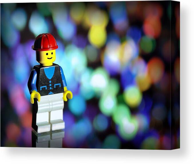 Toy Canvas Print featuring the photograph LegoMan by Mark Fuller