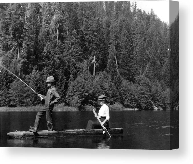 Boy Canvas Print featuring the photograph Boy Fishing Hollowed Log Boat 1910s Black White by Mark Goebel