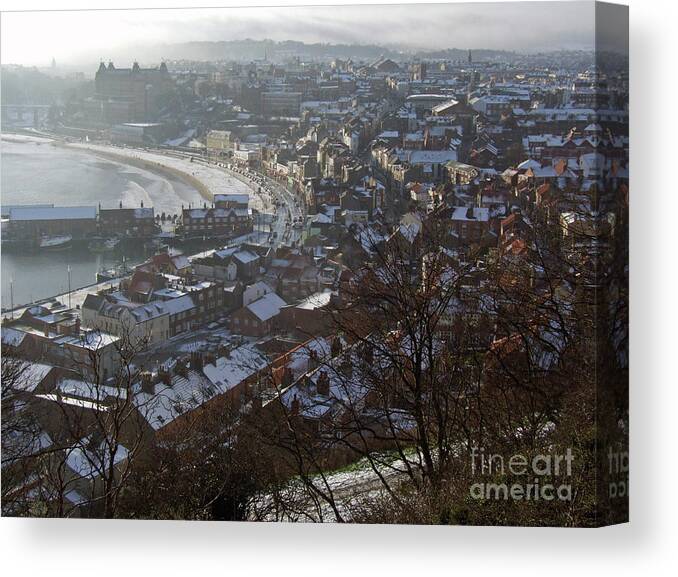 Snow Showers Canvas Print featuring the photograph A Winter's Day at Scarborough by Phil Banks