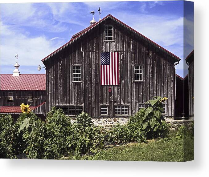 Large Brown Barn Canvas Print featuring the photograph Barn and American Flag by Sally Weigand