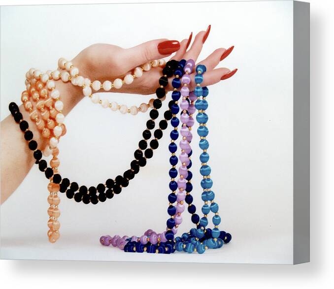 Advertising Canvas Print featuring the digital art Color beads in Hand by Gary De Capua