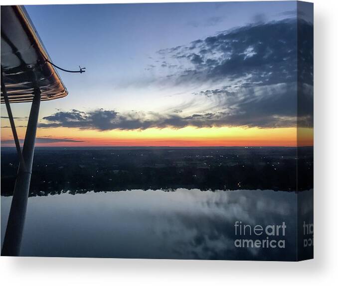 Flying Canvas Print featuring the photograph Flying at sunset by Paul Quinn