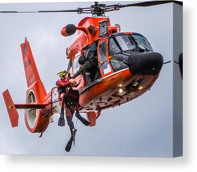Helicopter Canvas Print featuring the photograph Hoisting Into Helicopter by Gregory Daley MPSA