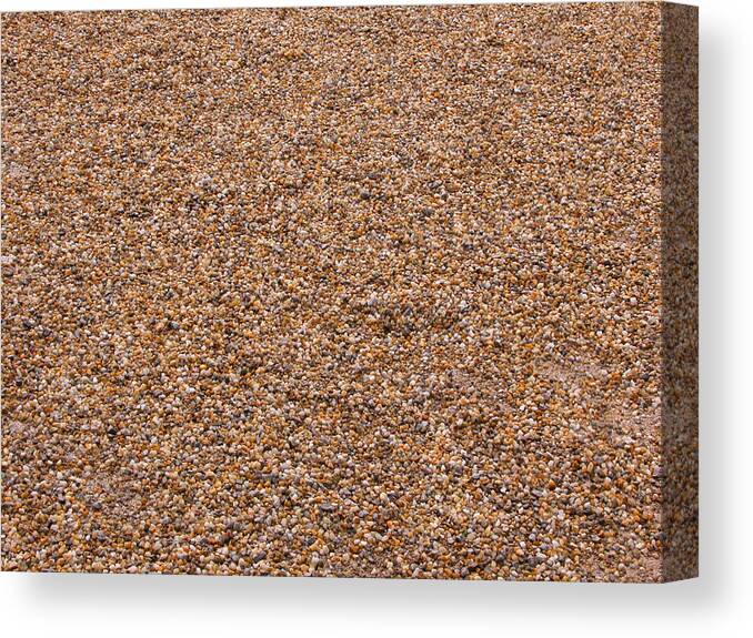 Abstract Canvas Print featuring the photograph Pebbles brown nature background by Michalakis Ppalis