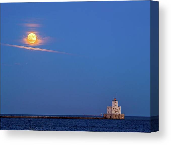 Lake Michigan Canvas Print featuring the photograph Supermoon over the white lighthouse by Kristine Hinrichs