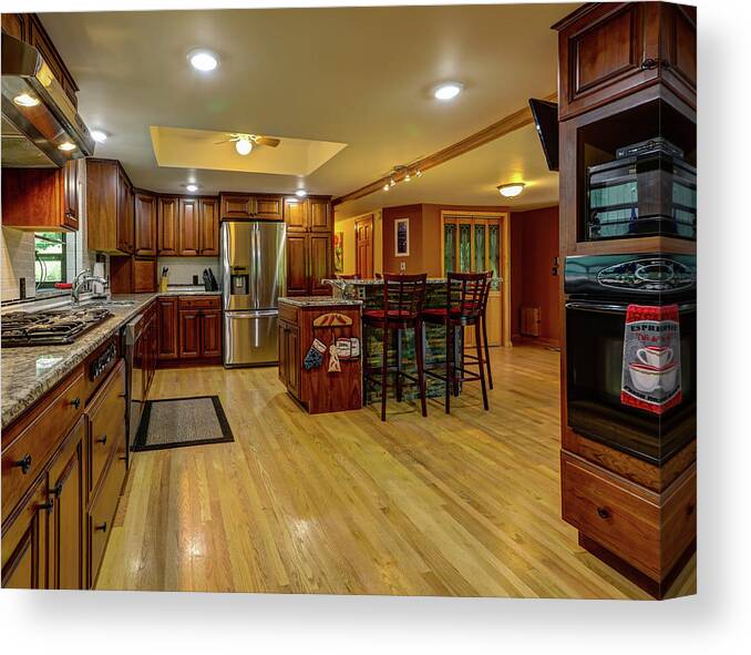 Real Estate Photography Canvas Print featuring the photograph This is the kitchen and dining room of the Burns Rd Chalet by Jeff Kurtz