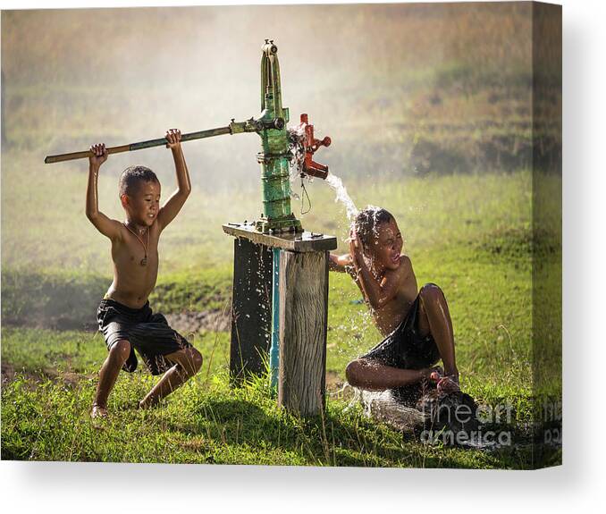 Sun Canvas Print featuring the photograph Two young boy rocking groundwater bathe in the hot days. by Tosporn Preede