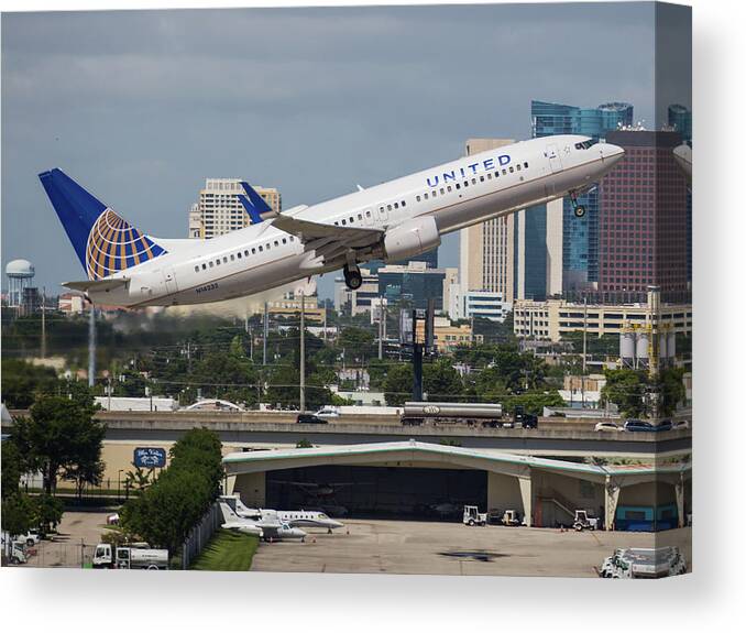 United Canvas Print featuring the photograph United Airlines by Dart Humeston
