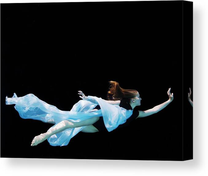 Ballet Dancer Canvas Print featuring the photograph Female Dancer Underwater Against Black by Thomas Barwick