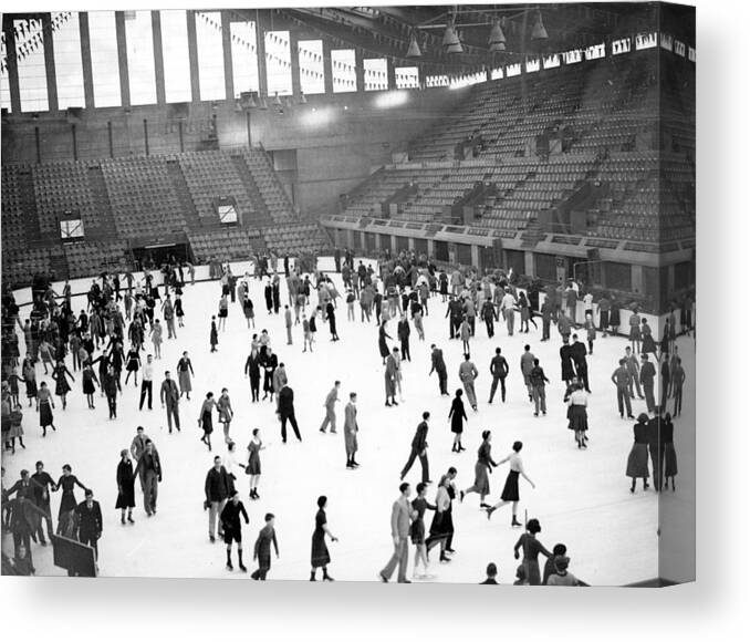 Crowd Canvas Print featuring the photograph Ice Skaters #1 by Fox Photos