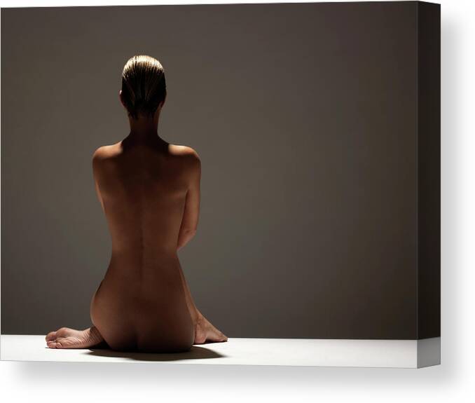 The Human Body Canvas Print featuring the photograph Naked Woman Sitting, Rear View #1 by John Lamb