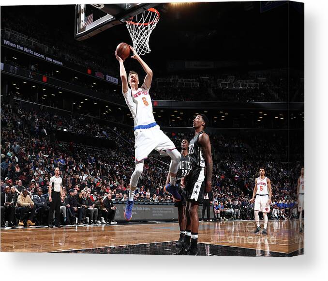 Kristaps Porzingis Canvas Print featuring the photograph New York Knicks V Brooklyn Nets #5 by Nathaniel S. Butler