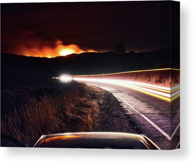Woodward Fire Canvas Print featuring the photograph Blurred Headlights On A Dark Road, Woodward Fire Burns In Point Reyes. by Cavan Images