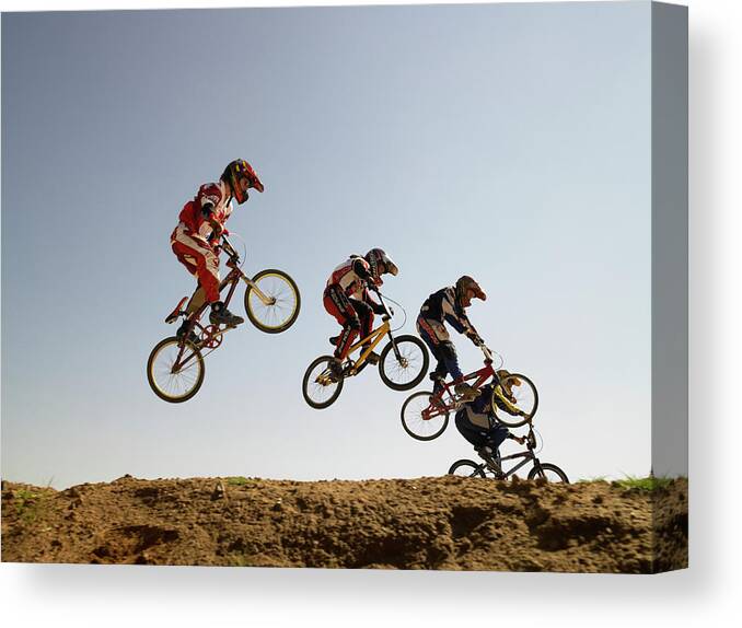 Child Canvas Print featuring the photograph Bmx Cyclists In Competition by Sean Justice