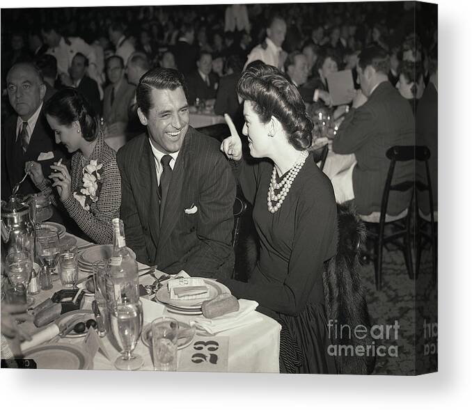 Cary Grant Canvas Print featuring the photograph Cary Grant And Rosalind Russell by Bettmann