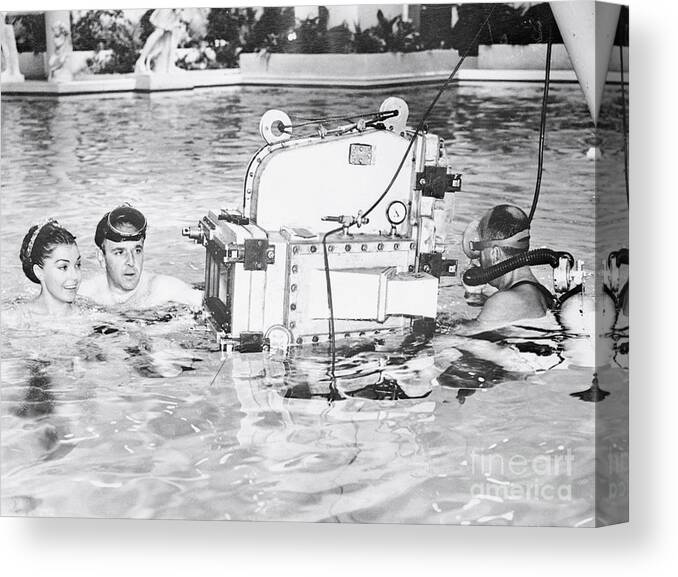 Working Canvas Print featuring the photograph Esther Williams And Howard Keel Filming by Bettmann