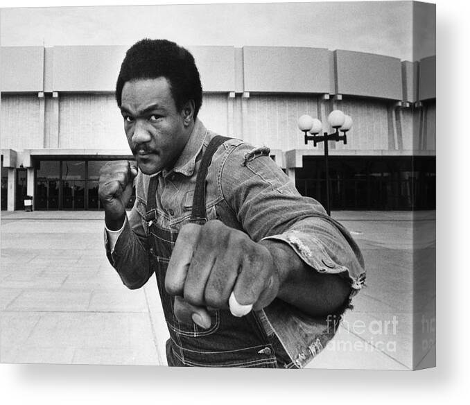 Joe Frazier Canvas Print featuring the photograph George Foreman In Fight Pose At Nassau by Bettmann