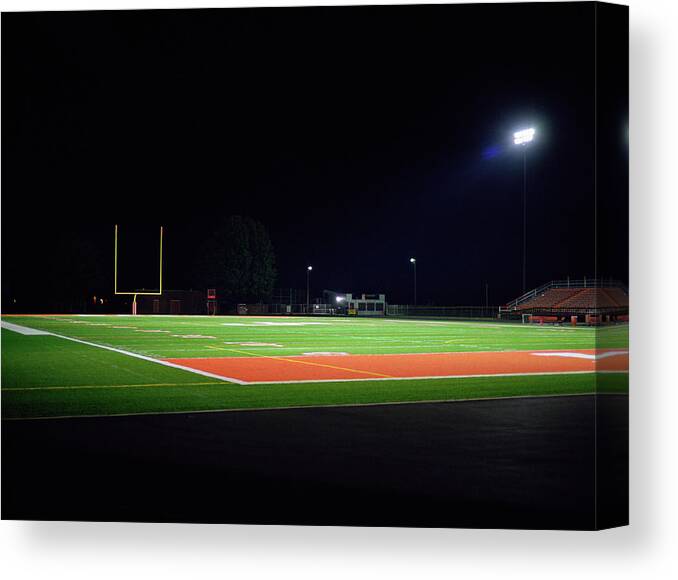 Team Sport Canvas Print featuring the photograph Illuminated American Football Field At by Darrin Klimek