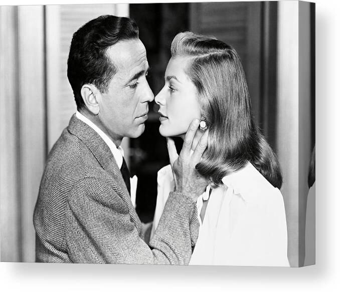 Humphrey Bogart Canvas Print featuring the photograph LAUREN BACALL and HUMPHREY BOGART in DARK PASSAGE -1947-. by Album