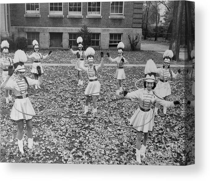 People Canvas Print featuring the photograph Majorettes Hula Hooping by Bettmann