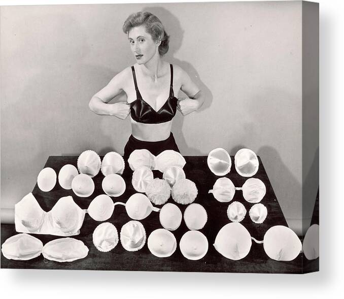 Clothing Canvas Print featuring the photograph Model demonstrating bras by Bernard Hoffman