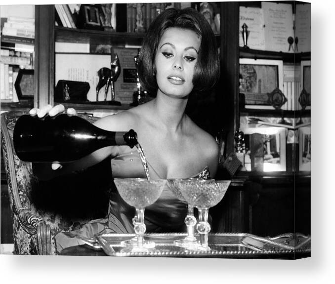 1963 Canvas Print featuring the photograph Sophia Loren Pouring Champagne by Globe Photos