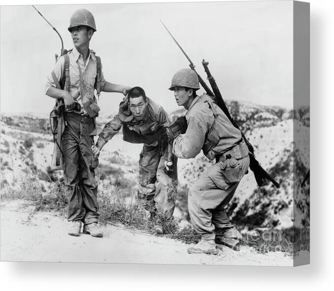 Hiding Canvas Print featuring the photograph South Korean Soldiers Dragging North by Bettmann