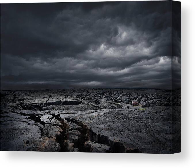 Mauna Loa Canvas Print featuring the photograph Storm Clouds Over Dry Rocky Landscape by Chris Clor