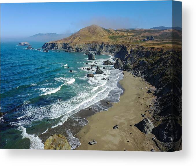 Landscapeaerial Canvas Print featuring the photograph The Cold Pacific Ocean Washes by Ethan Daniels