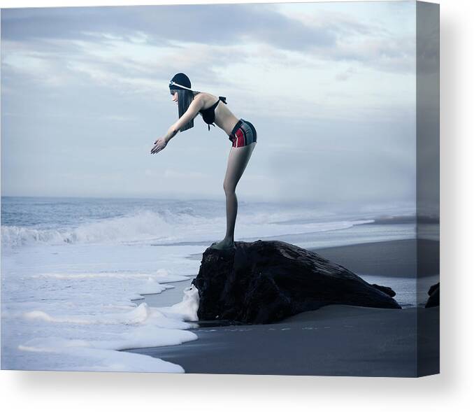 Diving Into Water Canvas Print featuring the photograph The Swimmer by Colin Anderson