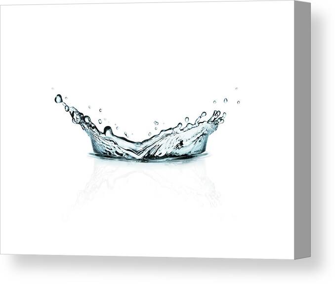 Spray Canvas Print featuring the photograph Watersplash Isolated On White Background by Kedsanee