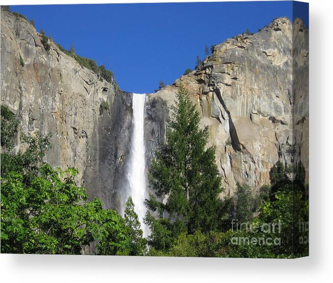 Yosemite Canvas Print featuring the photograph Yosemite National Park Bridal Veil Falls Waterfall Close Up View with Clear Blue Sky by John Shiron