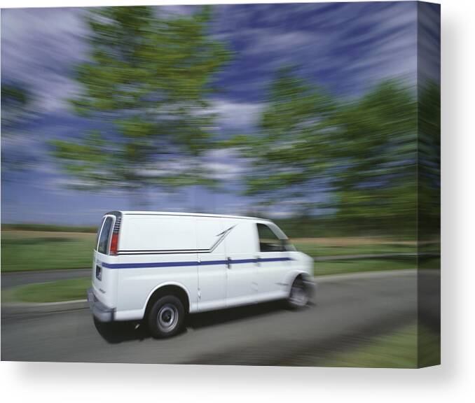 Blurred Motion Canvas Print featuring the photograph Delivery van travelling on country road by Ryan McVay