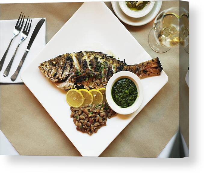 Bean Canvas Print featuring the photograph Fish grilled with salsa verde and cranberry beans, close-up by Thomas Barwick
