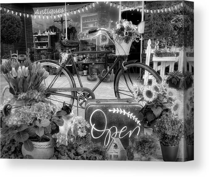 Fence Canvas Print featuring the photograph Flowers and Bike on the Sidewalk Black and White by Debra and Dave Vanderlaan