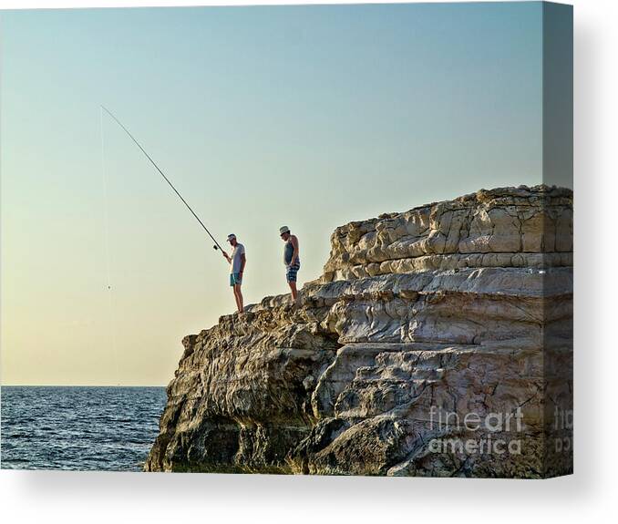 Life-style Beautiful Pleasant Warm Dusk Fishing Sea Blue Pinky Yellow Sky Quiet Calm Two Duo Couple Man Hobbies People Persons Figures Hill Watching Waiting Sunbathing Enjoying Enjoyable Serene Alone Delicate Gentle Delightful Mindfulness Friends Conceptual Relaxing Relaxation Cyprus Landscape Seascape Holiday Vacation Summer Dream Humor Angling Trawling Rod Candid Photography Fishermen Fisherman Characters Pastel Untroubled Peaceful Still Cliff Catch Rest Restful Singular Bright Vibrant Day Wow Canvas Print featuring the photograph Life Is Beautiful - Fishing Dream Holiday by Tatiana Bogracheva