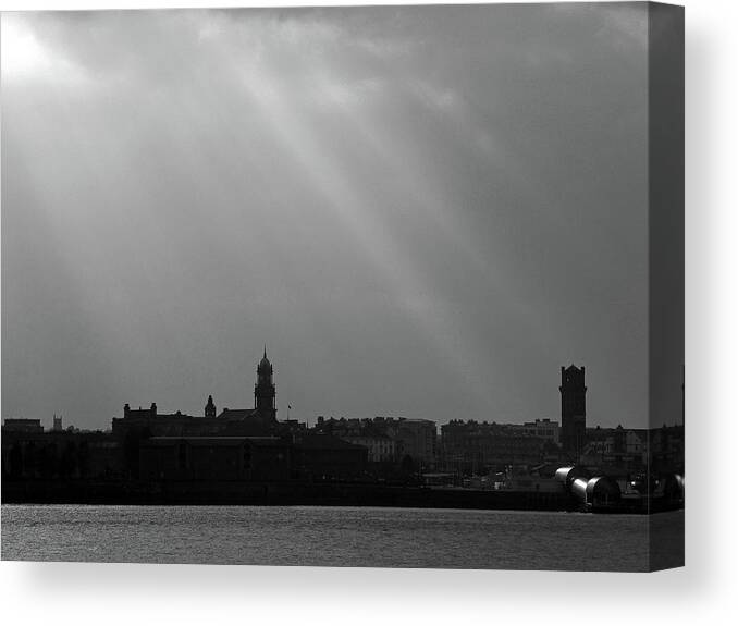 Liverpool; River Mersey; Black And White; Landscape; Cityscape; Skyline; Great Britain; Merseyside; Wirral Birkenhead; Sunbeams; Silhouette; Sky; Clouds; England; Canvas Print featuring the photograph Mersey Sunbeams by Lachlan Main