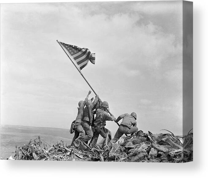 Iwo Jima Canvas Print featuring the photograph Raising the Flag on Iwo Jima - WW2 - 1945 by War Is Hell Store