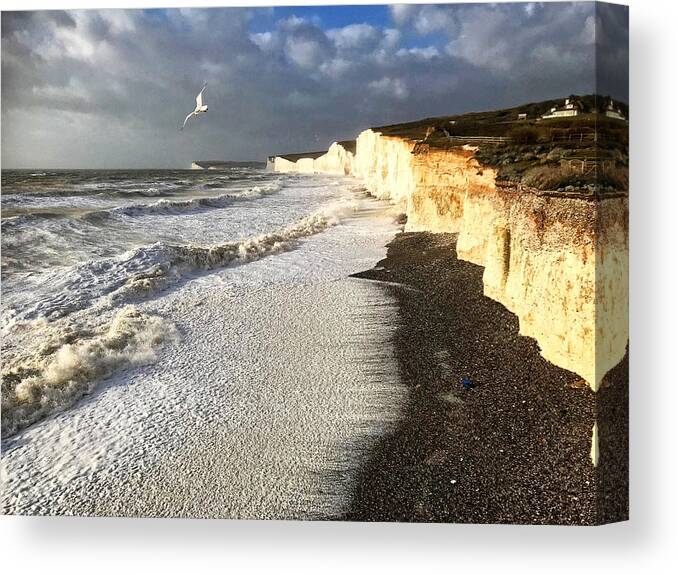 Wind Canvas Print featuring the photograph Rough Seas eroding chalk cliffs by Patricia Hamilton