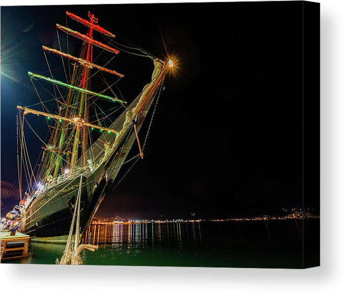 Anchored Canvas Print featuring the photograph Sailing ship anchored at night by Umberto Barone